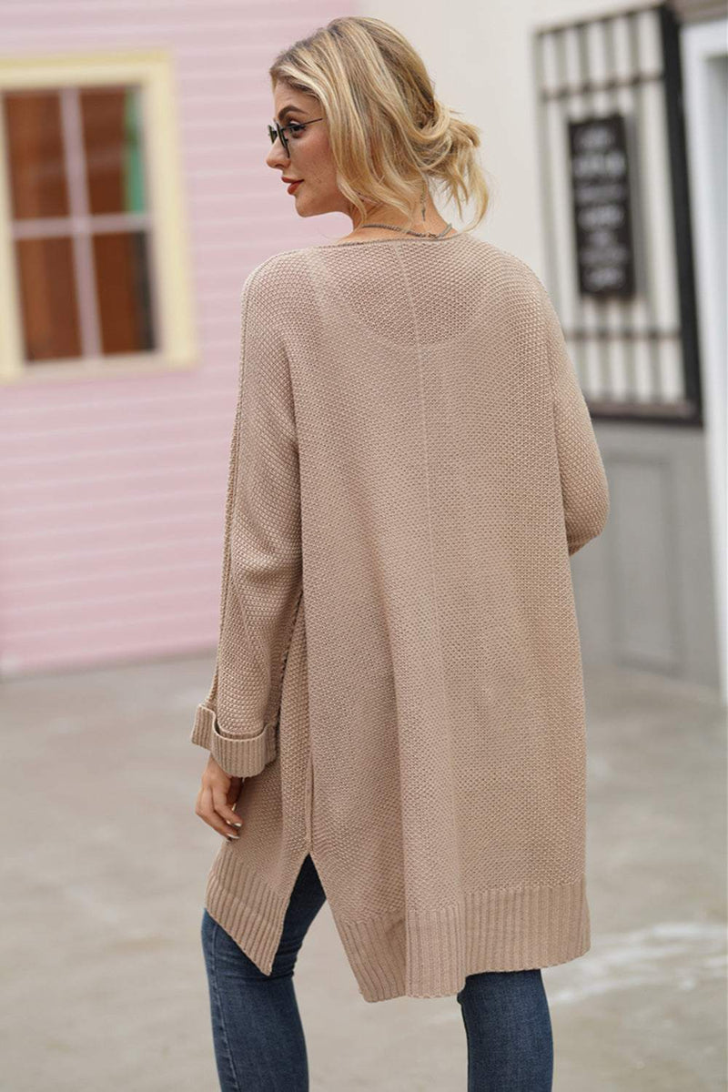 Open front long sleeve cardigan in beige, slightly stretchy acrylic material.