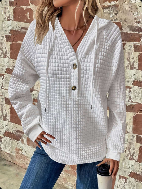 Full Size Texture Button Detail Drawstring Long Sleeve Hoodie in white on model.