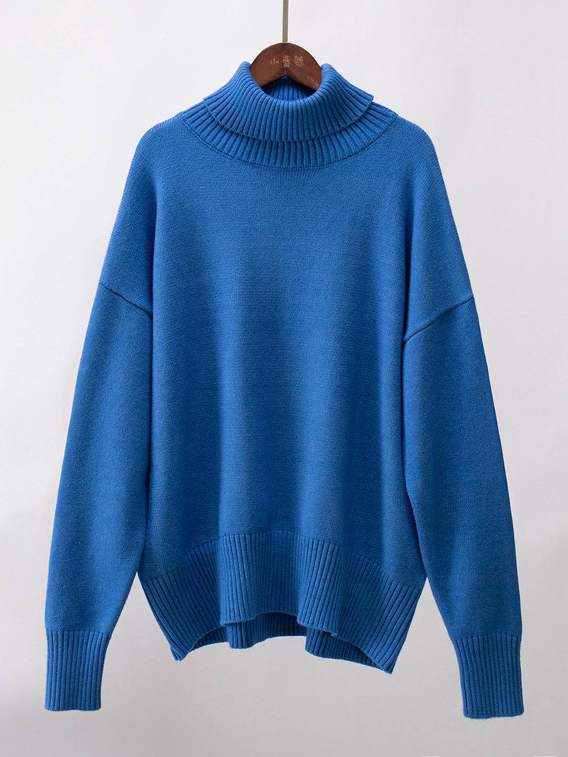 Blue turtleneck long sleeve sweater made of viscose, polyester, and nylon blend.