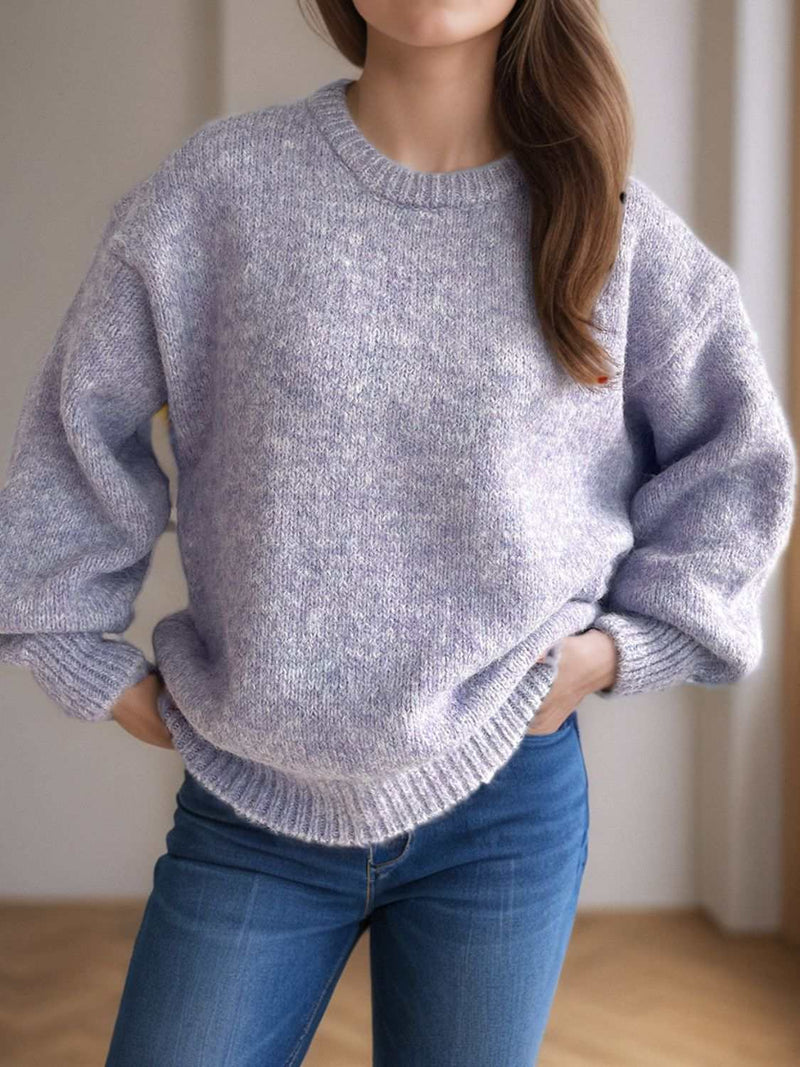 Round neck long sleeve sweater in soft fabric, perfect for warmth and style.
