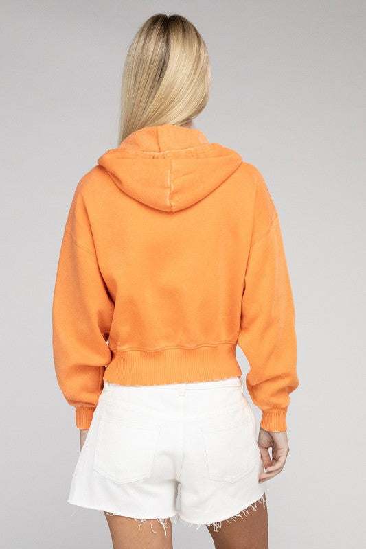 Acid wash fleece cropped zip-up hoodie in vibrant orange, featuring a drawstring hood and relaxed fit.