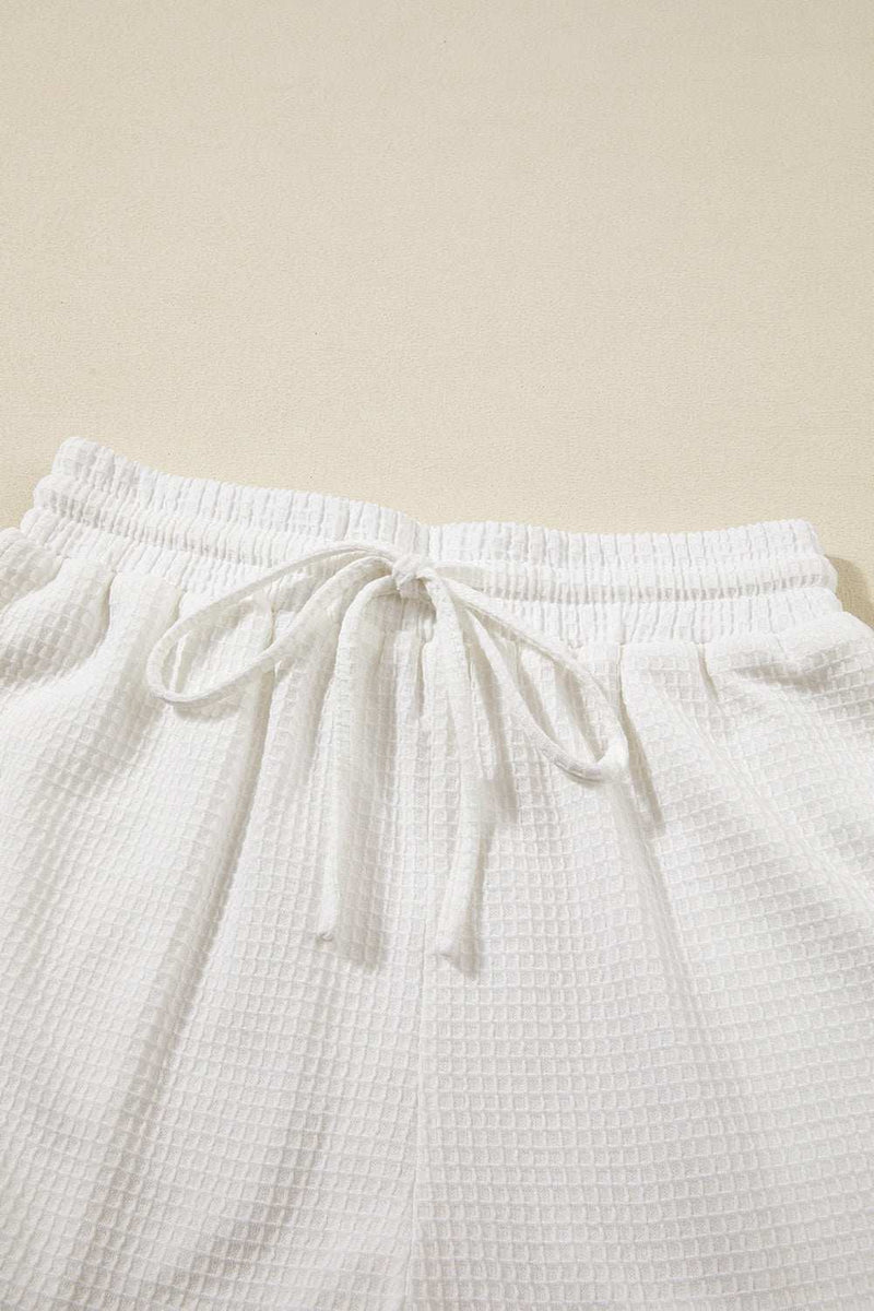 Round Neck Short Sleeve Top and Drawstring Shorts SetFeatures: Drawstring
Number of pieces: Two-piece
Stretch: Slightly stretchy
Material composition: 75% polyester, 25% viscose
Care instructions: Machine wash cold. TuAll TopsTrendsiKlondike Creek Unique BoutiqueRound Neck Short Sleeve Top