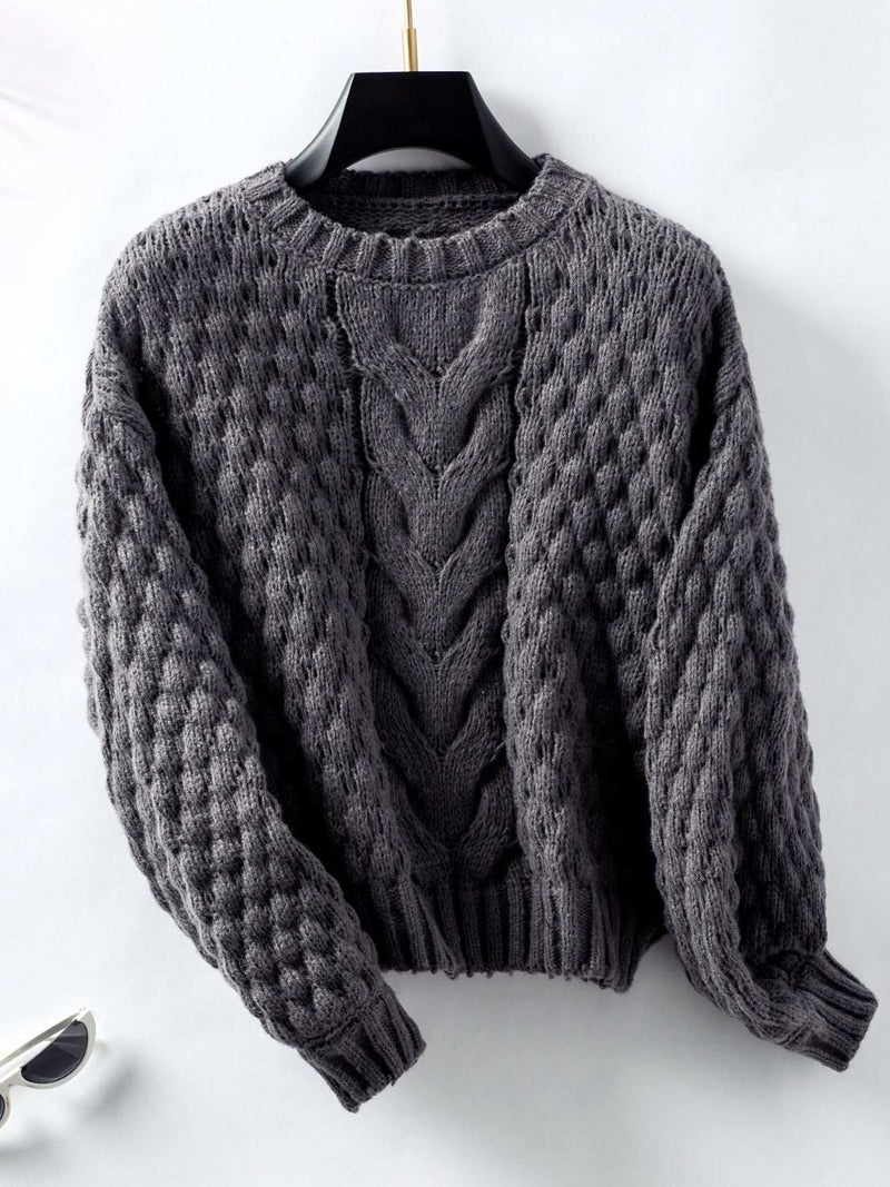 Cable-Knit Round Neck Long Sleeve Sweater in gray on a hanger