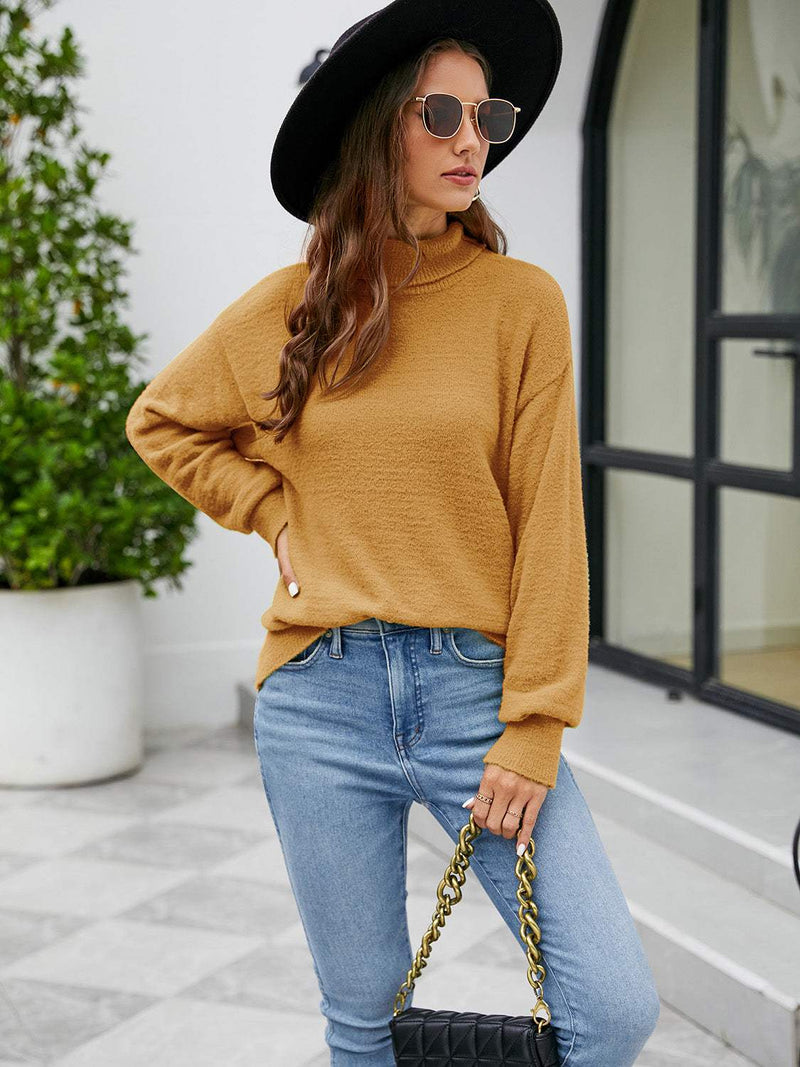 Turtleneck dropped shoulder sweater in mustard, slightly stretchy nylon.