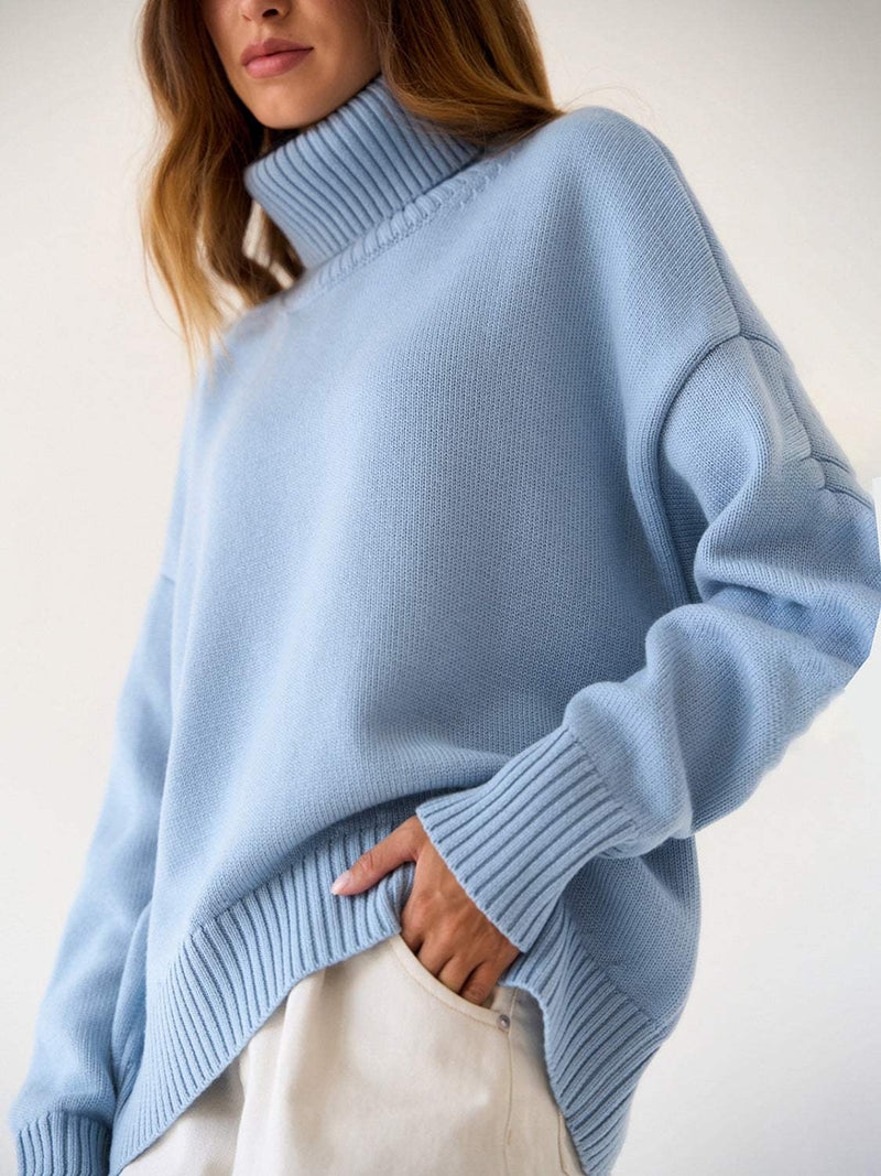 Turtleneck long sleeve sweater in light blue with ribbed cuffs and hem.