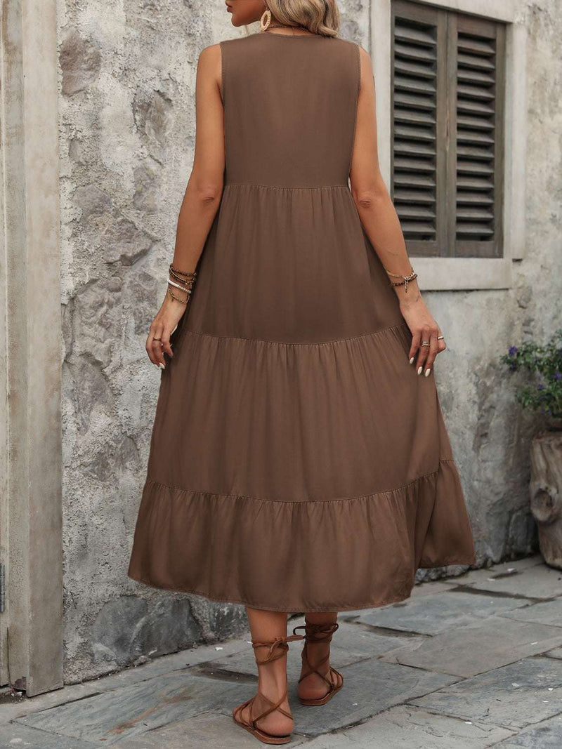 Ivy Lane decorative button notched sleeveless dress in brown, shown from the back, with a tiered design.