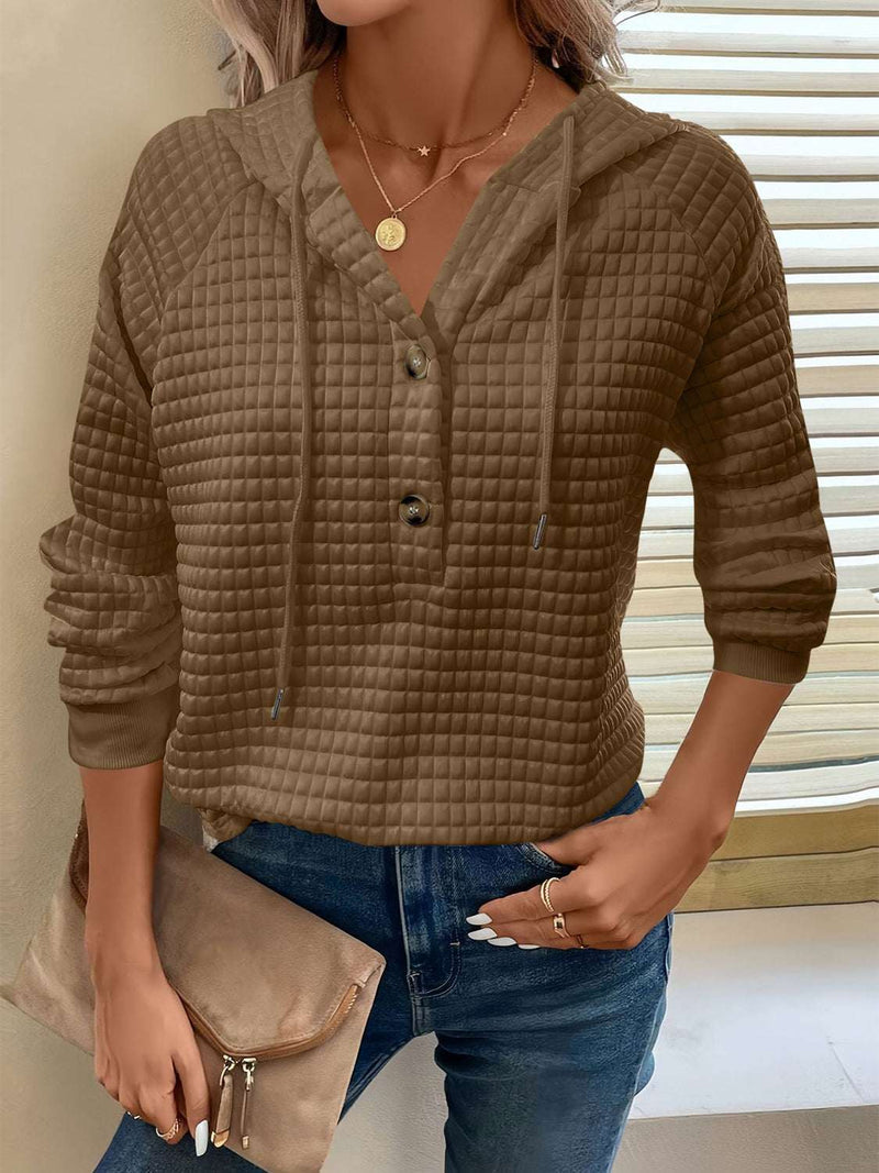 Full size textured button detail drawstring hoodie with long sleeves.