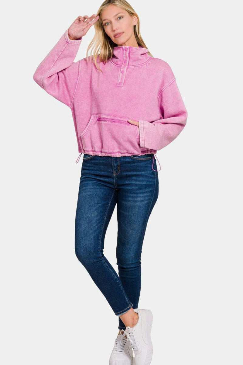 Zenana Acid Wash Fleece Half Snap Sweatshirt with Pocket in pink, styled with jeans.