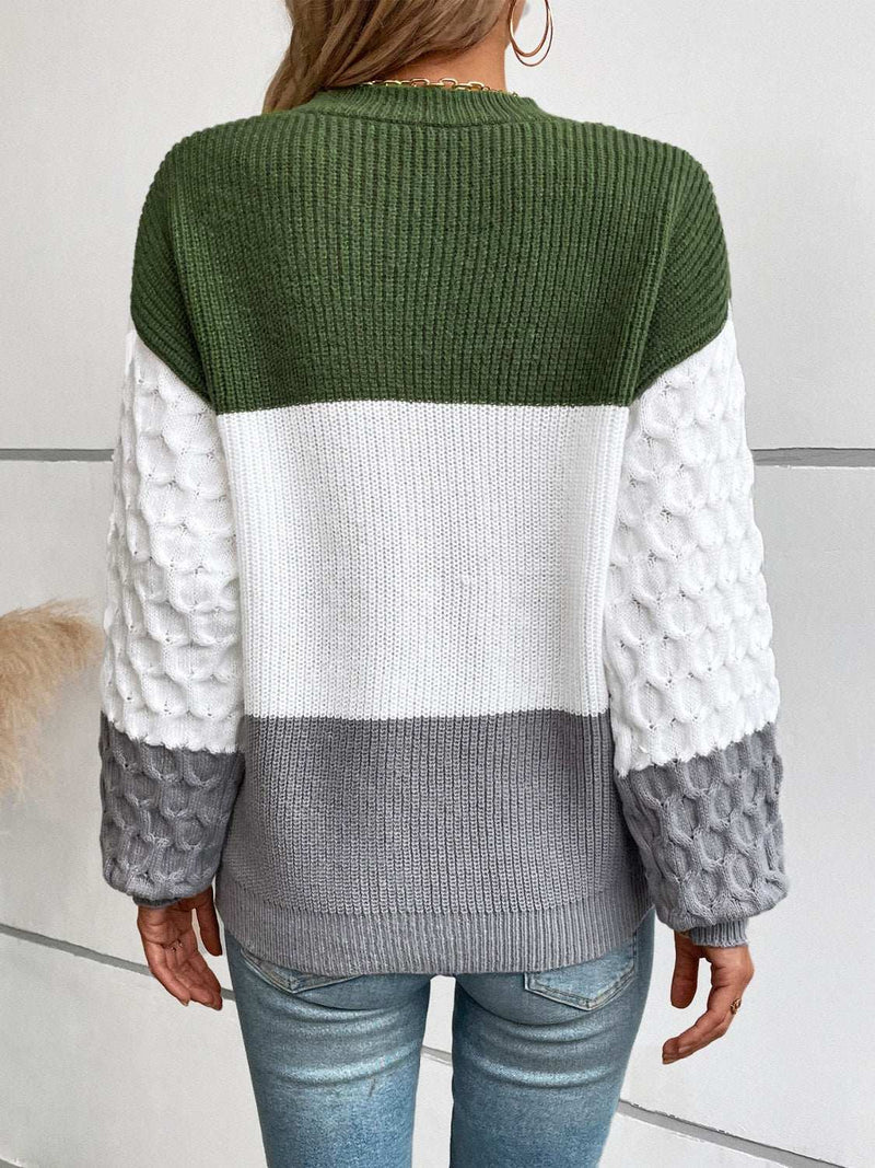 Color block round neck long sleeve sweater with green, white, and gray sections.