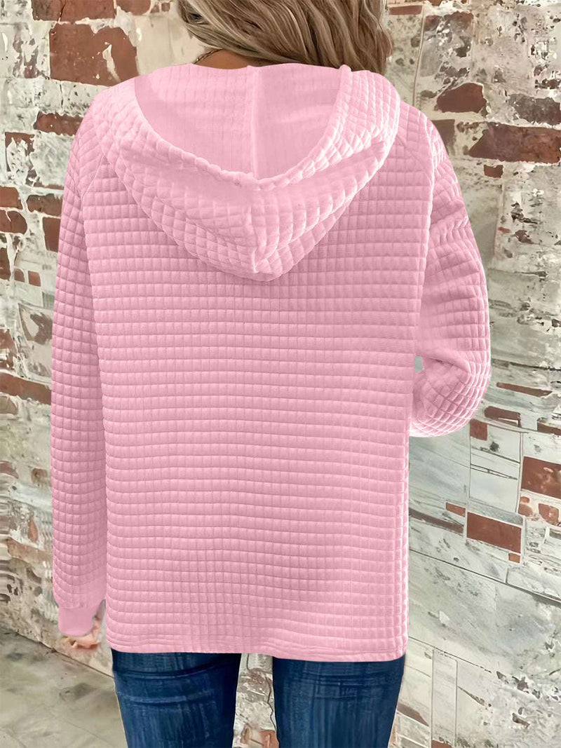 Full Size Texture Button Detail Drawstring Long Sleeve Hoodie in pink, featuring a textured design and attached hood.