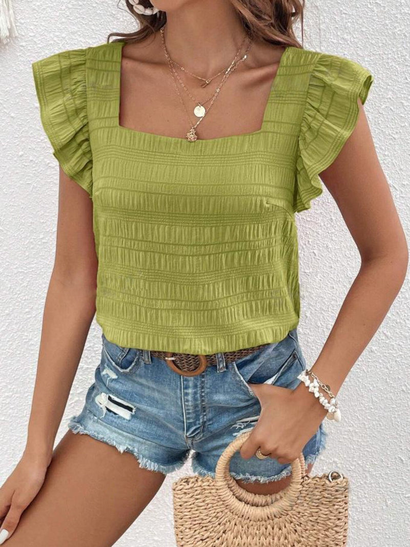 Ruffled square neck cap sleeve blouse in green with textured fabric detail.