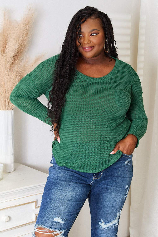 Culture Code full size scoop neck top with patch pocket, modeled by woman wearing distressed jeans.