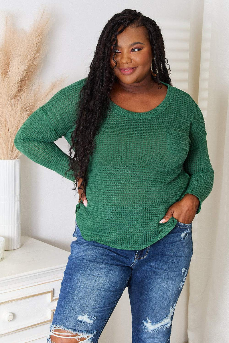 Culture Code full size scoop neck top with patch pocket, modeled by woman wearing distressed jeans.