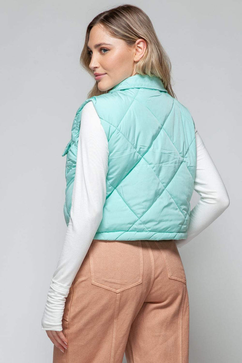 Snobbish Snap Down Quilted Crop VestThe snap-down quilted crop vest is a stylish and versatile addition to your wardrobe. With its snap-button closure and cropped length, this vest offers a modern and OuterwareTrendsiKlondike Creek Unique BoutiqueQuilted Crop Vest