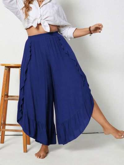 Plus size ruffled wide leg pants in blue with slits, made from 100% viscose.