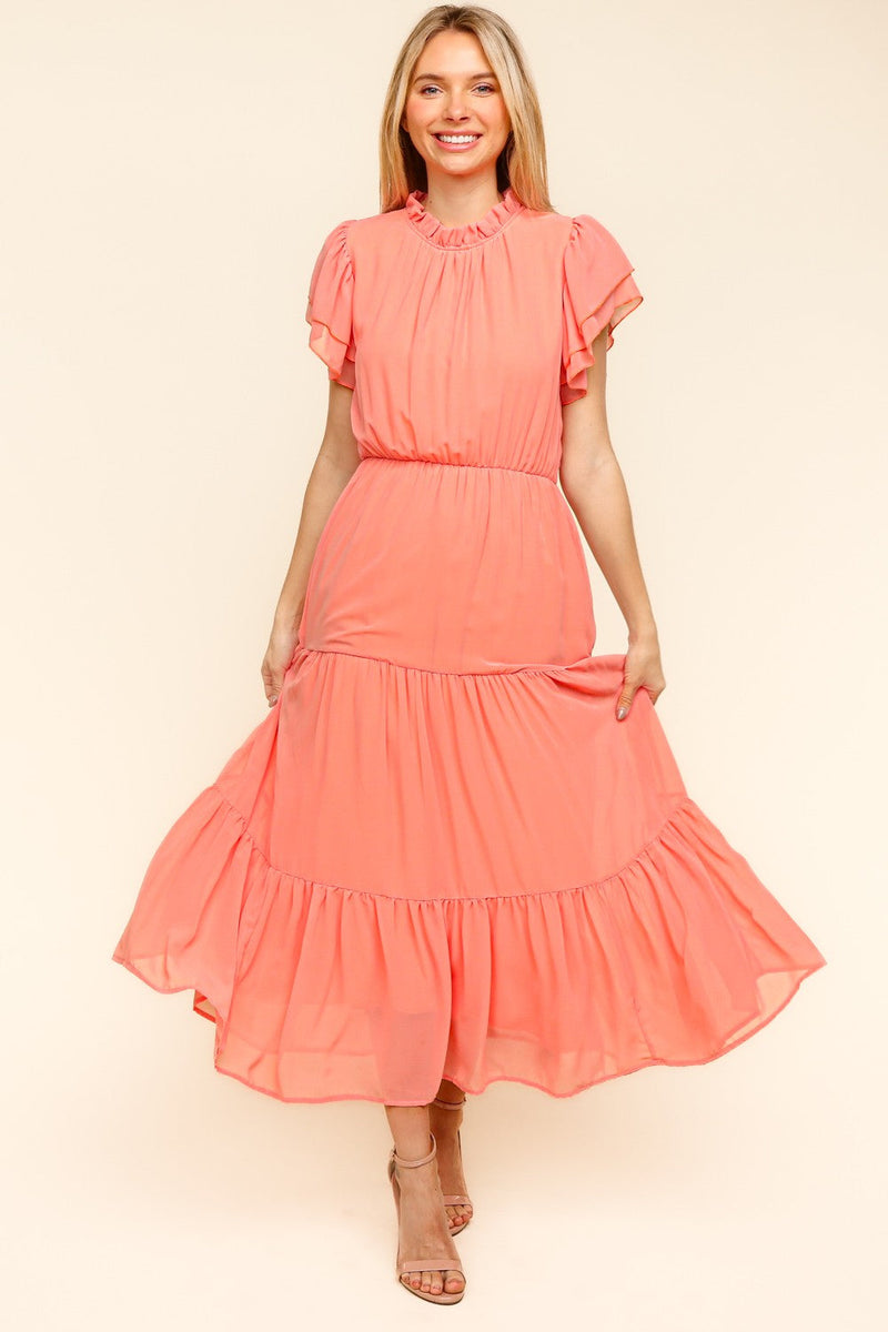 Haptics Full Size Tiered Frill Mock Neck Short Sleeve Dress in coral, showcasing elegant tiered frills and a modern mock neck style.