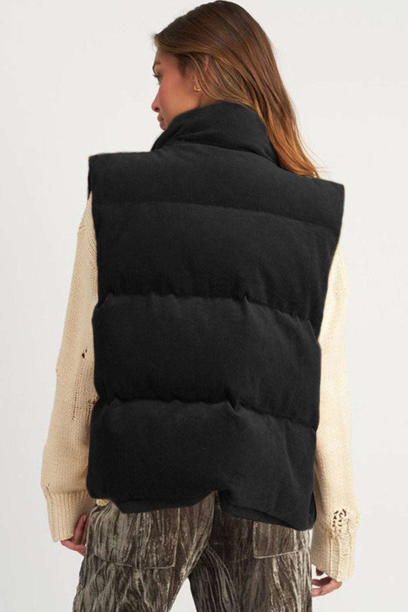 Coffee Corduroy Stand Neck Zipped Puffer Vest in rich coffee color, featuring stand neck design, side pockets, and puffer style for warmth and elegance.
