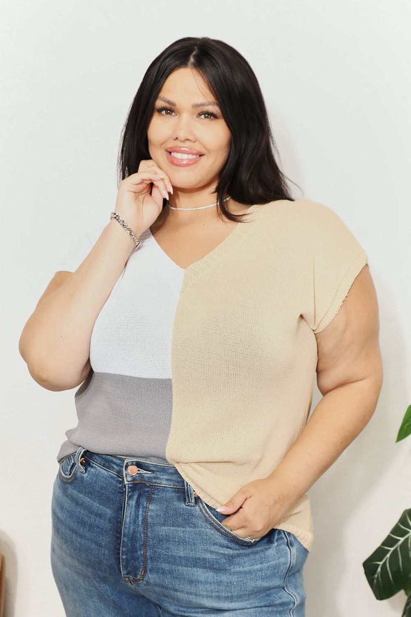 Color block V-neck knit top with short sleeves in beige, white, and gray.