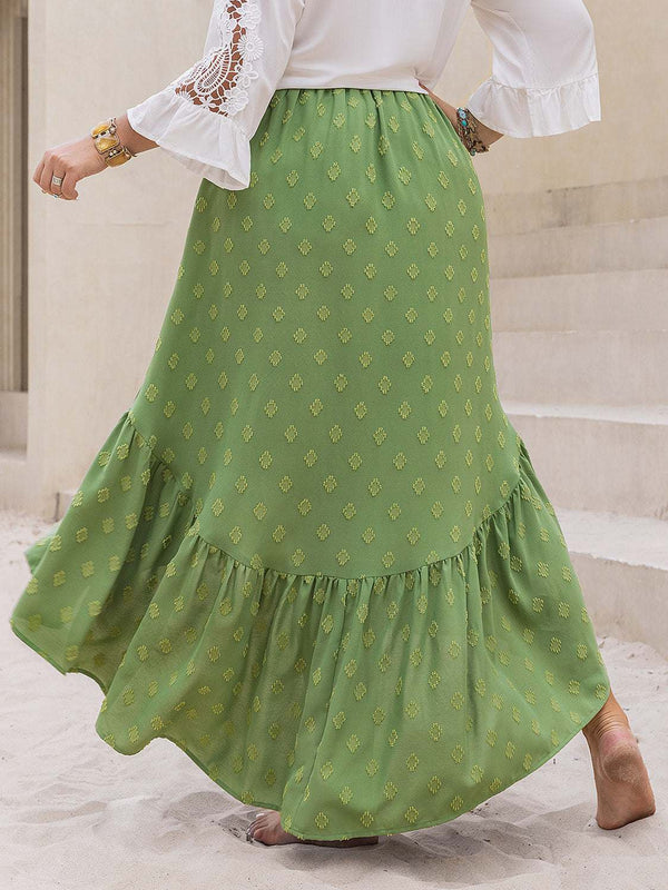 Plus size green high-low skirt with ruffled hem and patterned design.