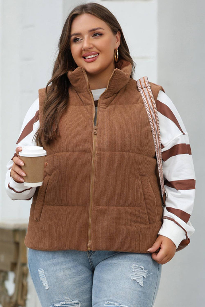 Coffee Corduroy Stand Neck Zipped Puffer VestStay warm and stylish this winter with our Coffee Corduroy Stand Neck Zipped Puffer Vest. Made from high-quality corduroy fabric, this vest is not only fashionable bOuterwear/VestsKlondike Creek Unique BoutiqueKlondike Creek Unique BoutiqueCoffee Corduroy Stand Neck Zipped Puffer Vest
