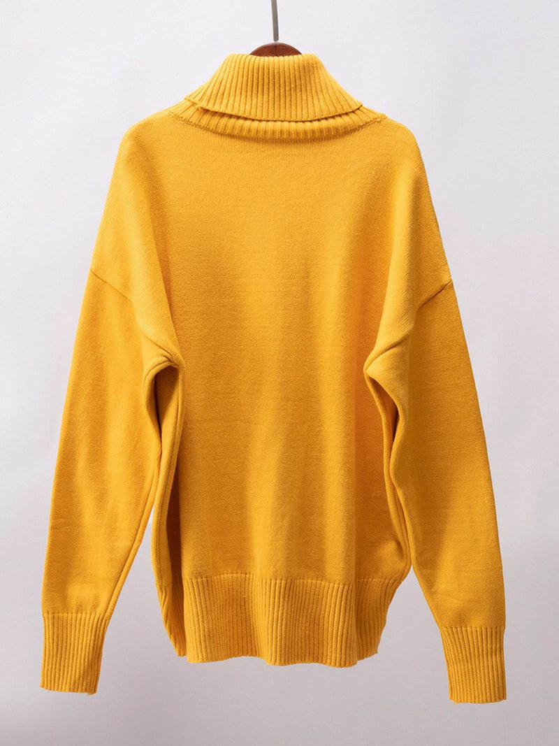 Yellow turtleneck long sleeve sweater made of viscose, polyester, and nylon.