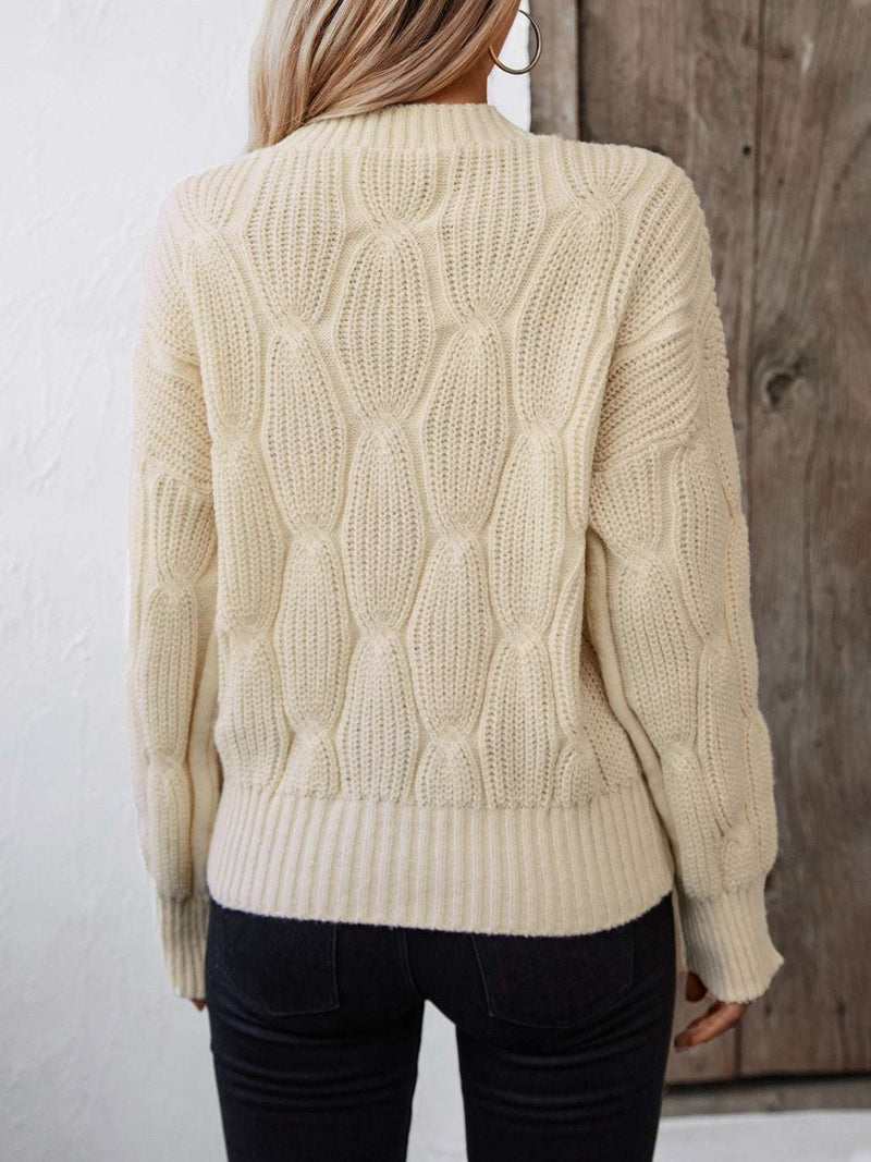Round Neck Dropped Shoulder Sweater in cream color with textured knit design.