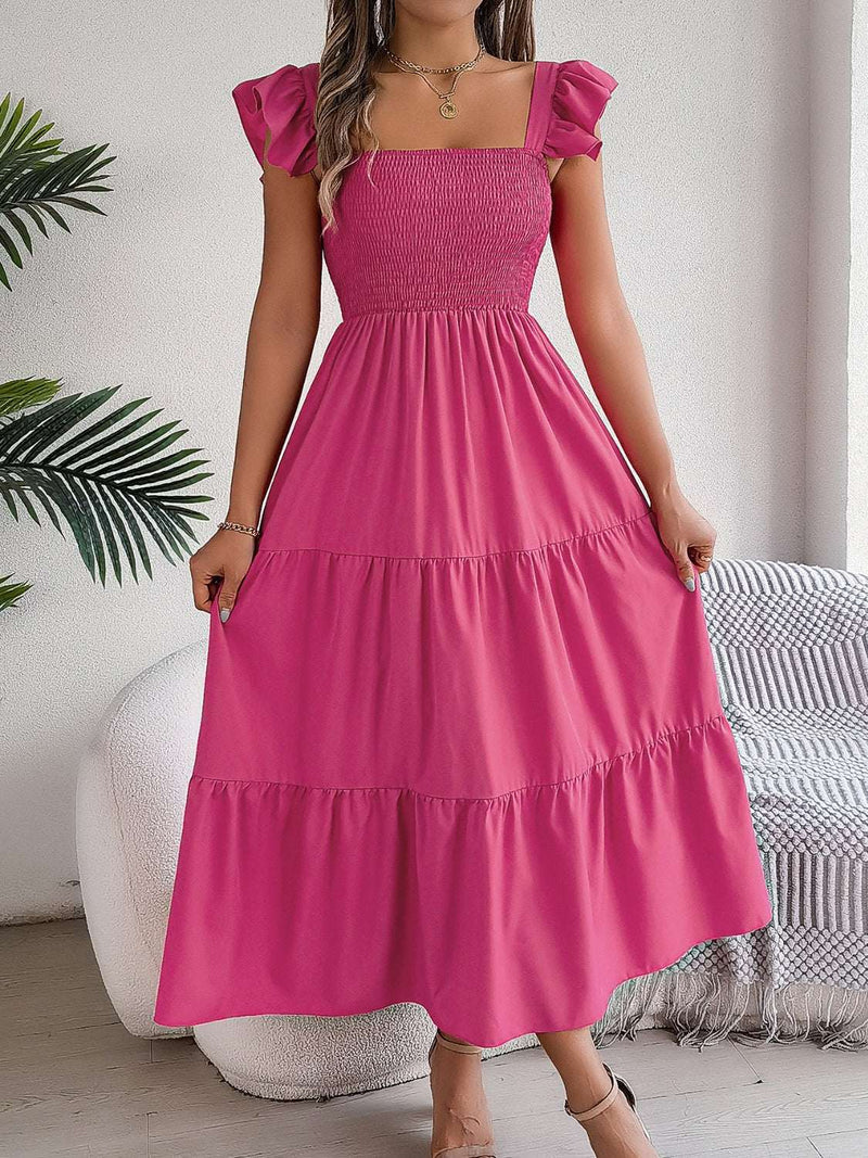 Smocked square neck cap sleeve midi dress in pink with tiered skirt.