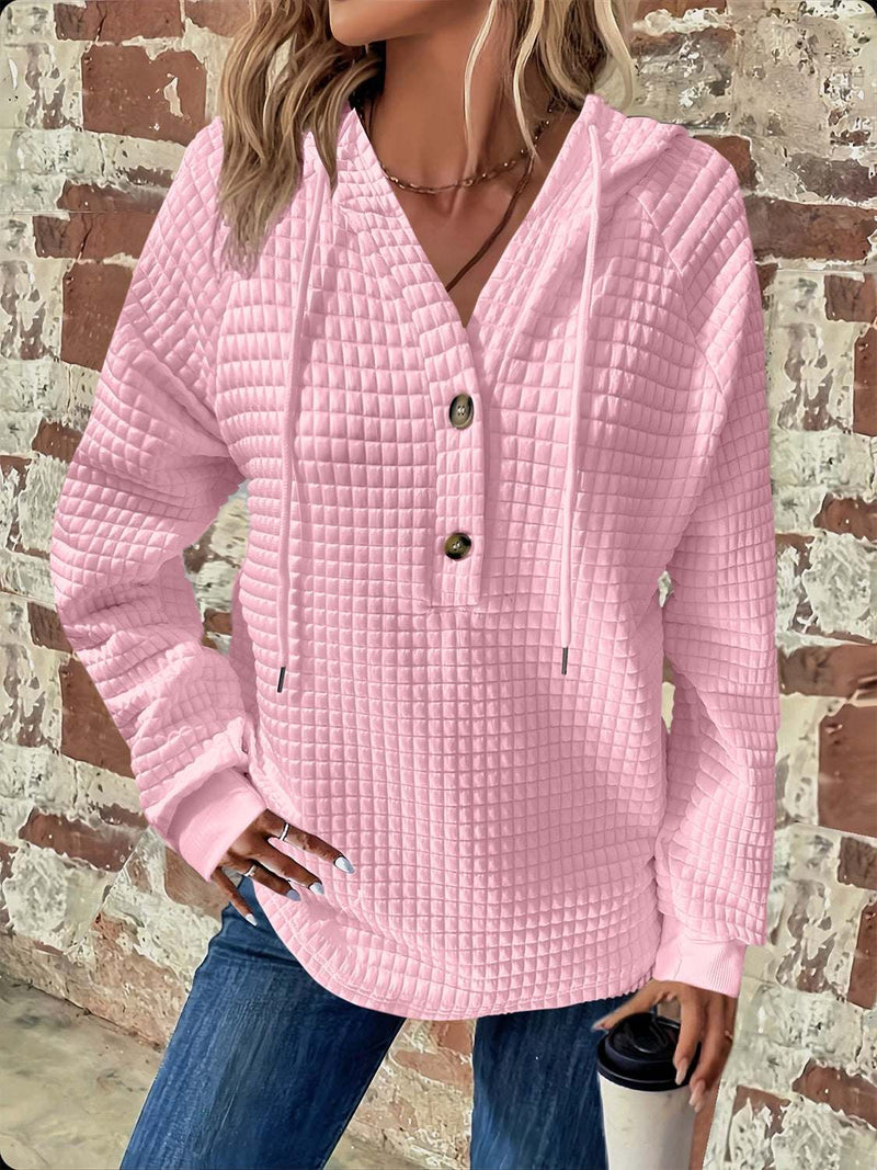 Full Size Texture Button Detail Drawstring Long Sleeve Hoodie in pink, featuring a buttoned, opaque design with no stretch, made from polyester and spandex.