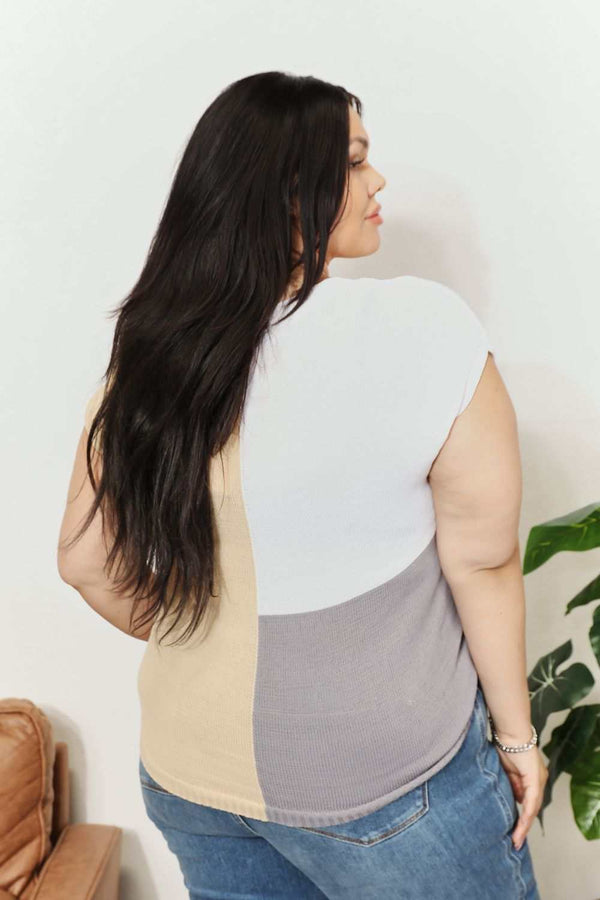 Color block V-neck knit top with short sleeves, shown on model.