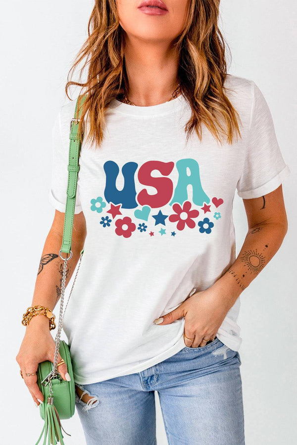 USA Round Neck Short Sleeve T-Shirt with floral design, worn by woman with jeans and accessories.