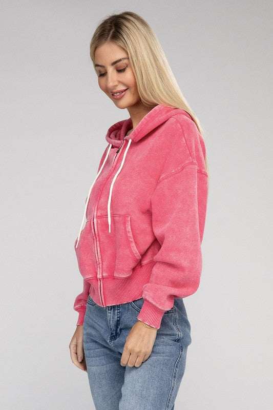 Acid wash fleece cropped zip-up hoodie with drawstring and pockets.
