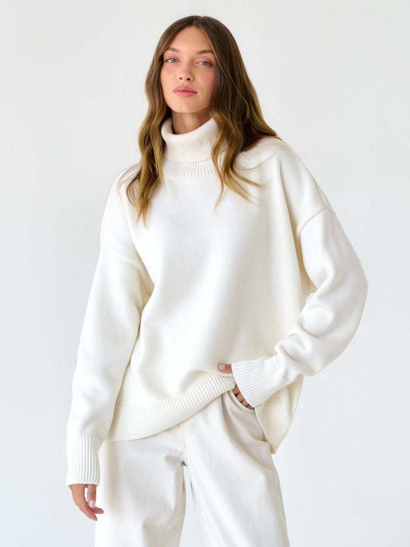 White turtleneck long sleeve sweater with slightly stretchy fabric.