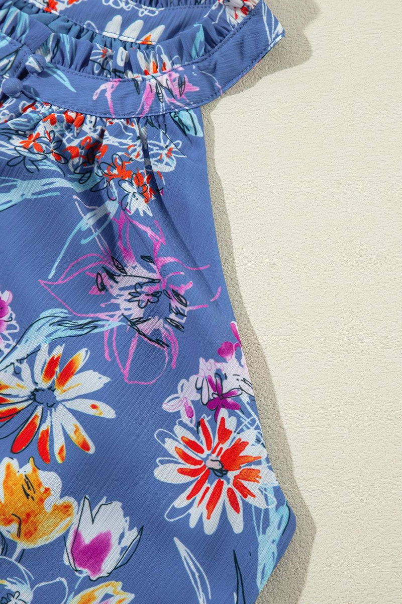 Frill printed Grecian tank top with vibrant floral design on blue fabric.