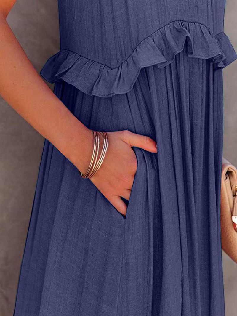 Ruffled sleeveless tiered maxi dress with pockets and high-low hem.