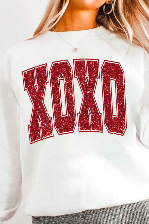 Valentine’s Day XOXO Glitter Round Neck Sweatshirt with red glitter letters on a white background.
