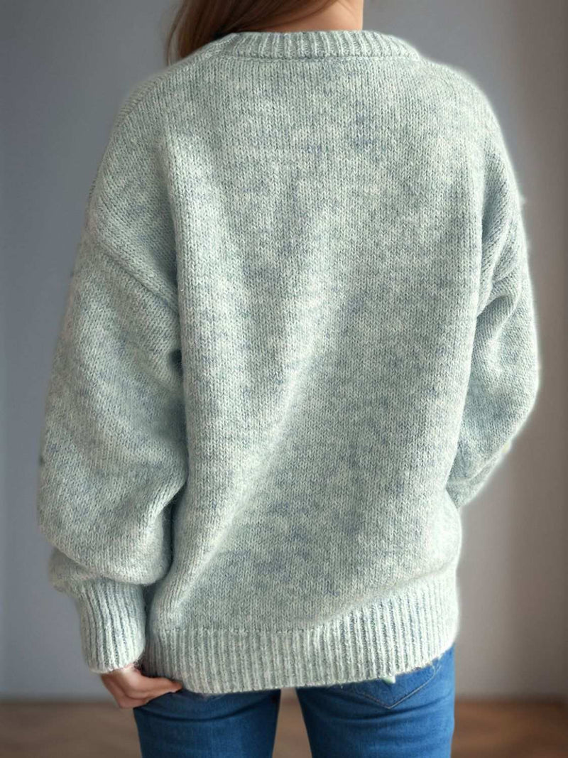 Round neck long sleeve sweater in soft fabric.