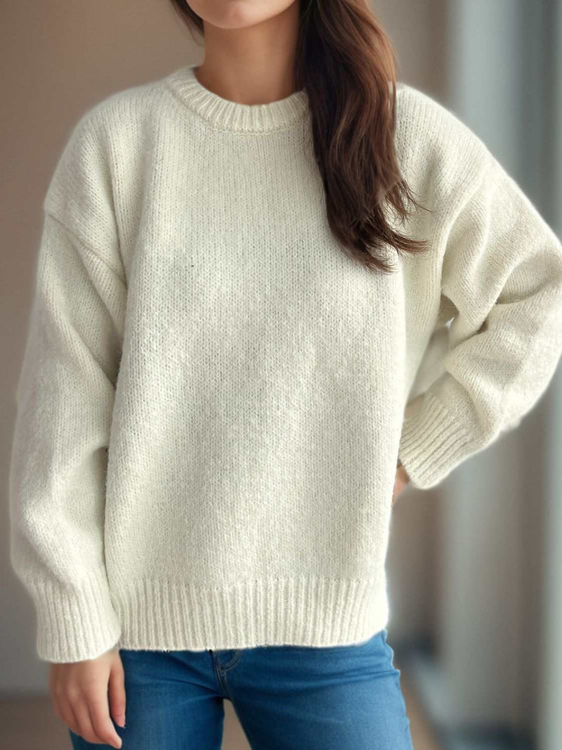 White round neck long sleeve sweater with relaxed fit for casual style.