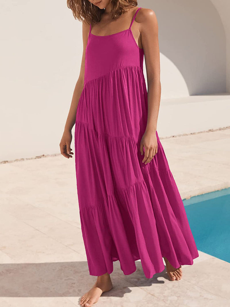 Full Size Ruched Tiered Spaghetti Strap Dress in vibrant pink near poolside.
