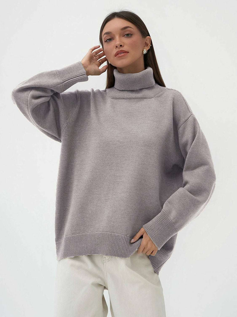 Gray turtleneck long sleeve sweater made from viscose, polyester, and nylon blend, featuring a basic style with slightly stretchy fabric.