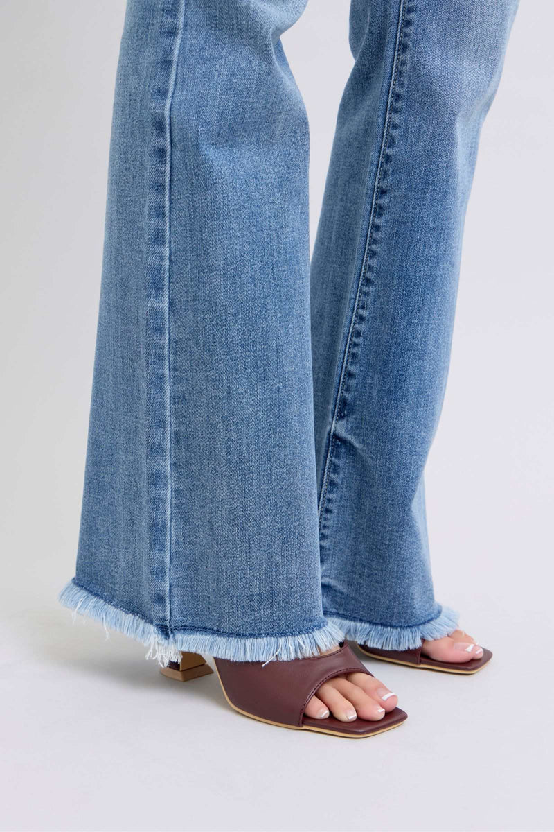 Judy Blue high rise bootcut jeans with raw hem, moderate stretch denim.