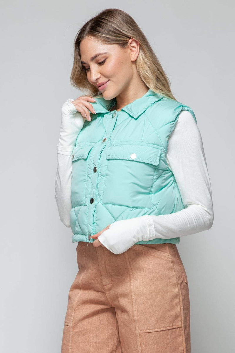 Snobbish Snap Down Quilted Crop VestThe snap-down quilted crop vest is a stylish and versatile addition to your wardrobe. With its snap-button closure and cropped length, this vest offers a modern and OuterwareTrendsiKlondike Creek Unique BoutiqueQuilted Crop Vest