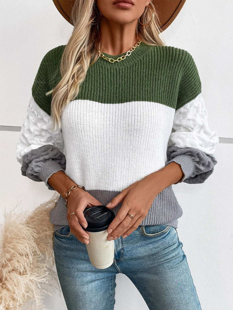 Color Block Round Neck Long Sleeve Sweater in vibrant colors worn by a woman holding a coffee cup.