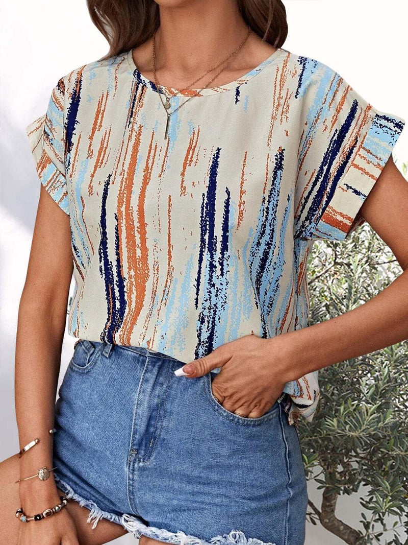 Printed round neck short sleeve blouse in multicolor pattern.