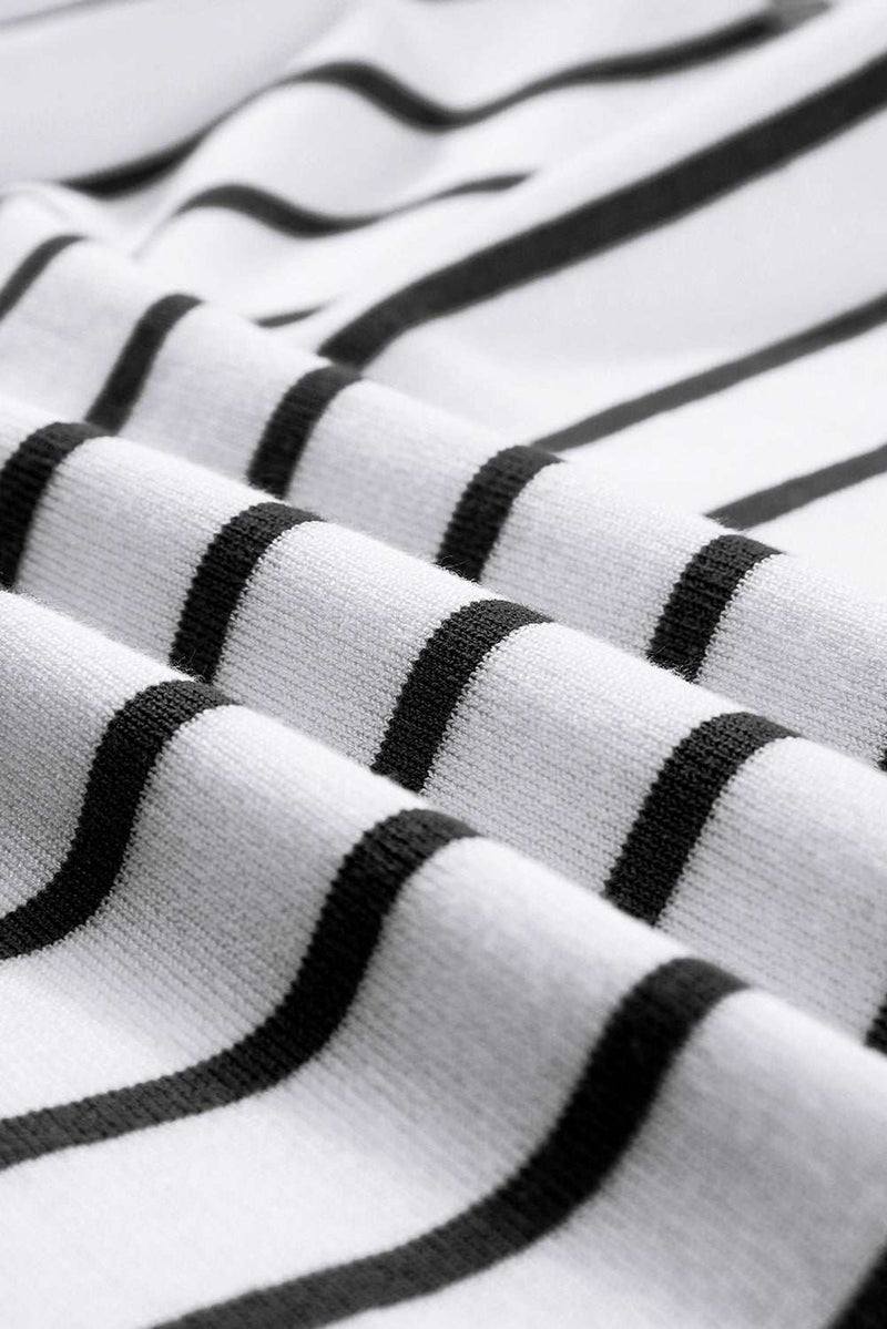 Fabric detail of the striped round neck cap sleeve knit top showcasing black stripes on a white background.