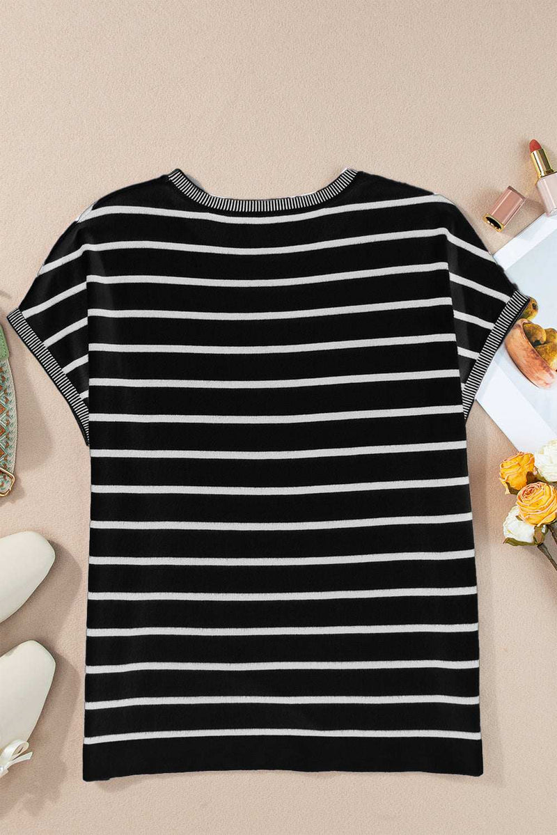 Striped round neck cap sleeve knit top in black and white.