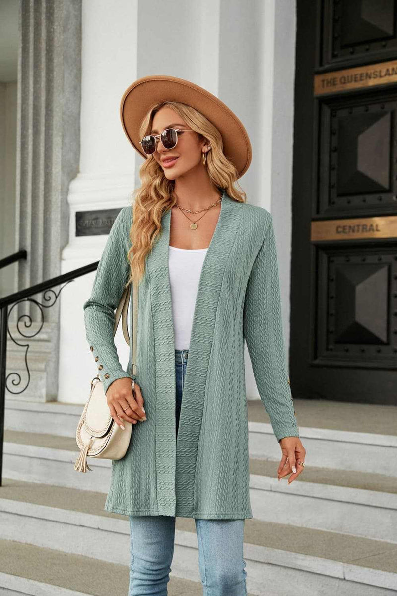 Long sleeve open front cardigan in solid color with long regular sleeves.