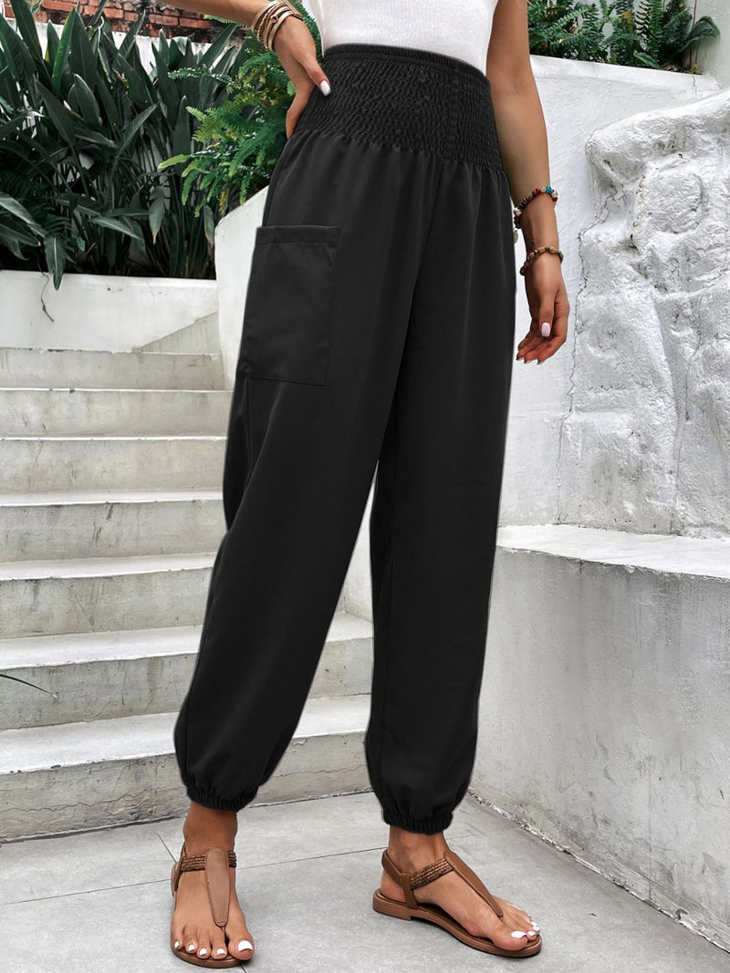 Smocked high rise joggers with pockets, black, polyester-spandex blend, casual style.