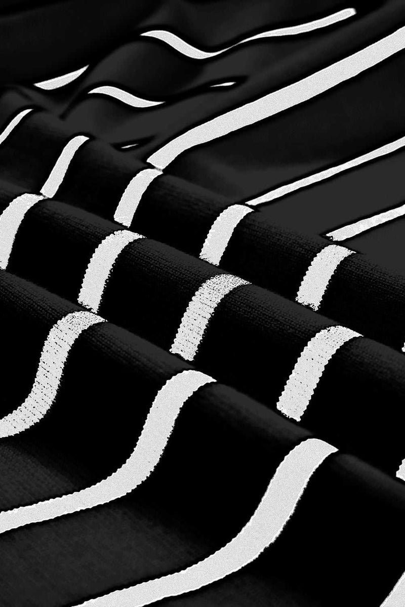 Striped black and white fabric texture of knit top.