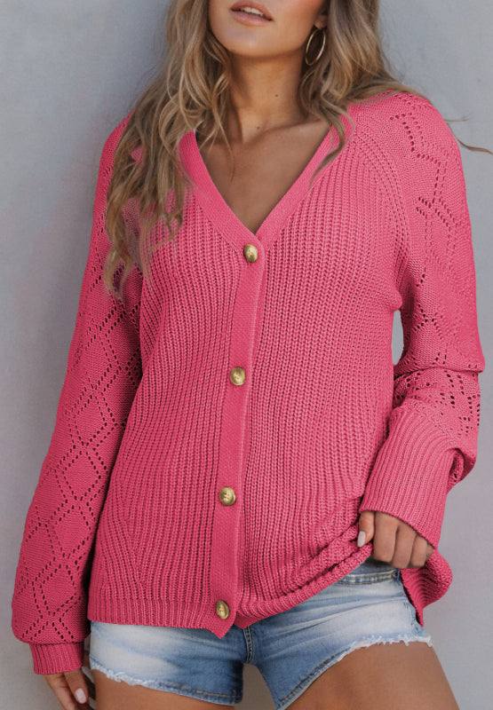 Pink openwork V-neck button-up cardigan on woman.