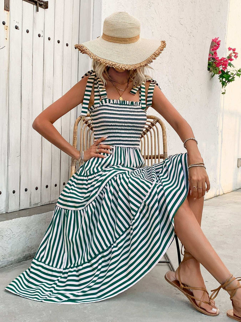 Perfee smocked striped square neck midi dress with tied straps, sitting outdoors.
